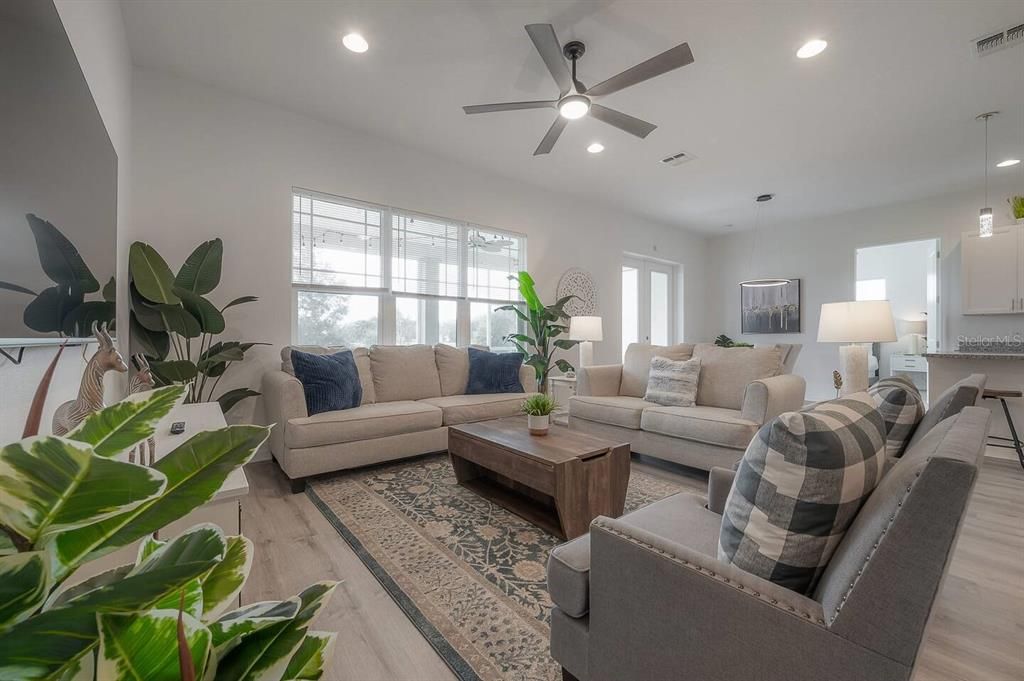 Living Area with Modern design with vaulted ceilings and open floorplan.