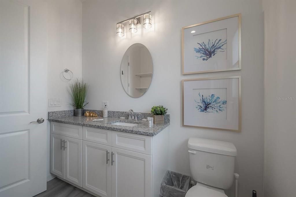 Bathroom 2 with tub and shower located between bedrooms two and three.