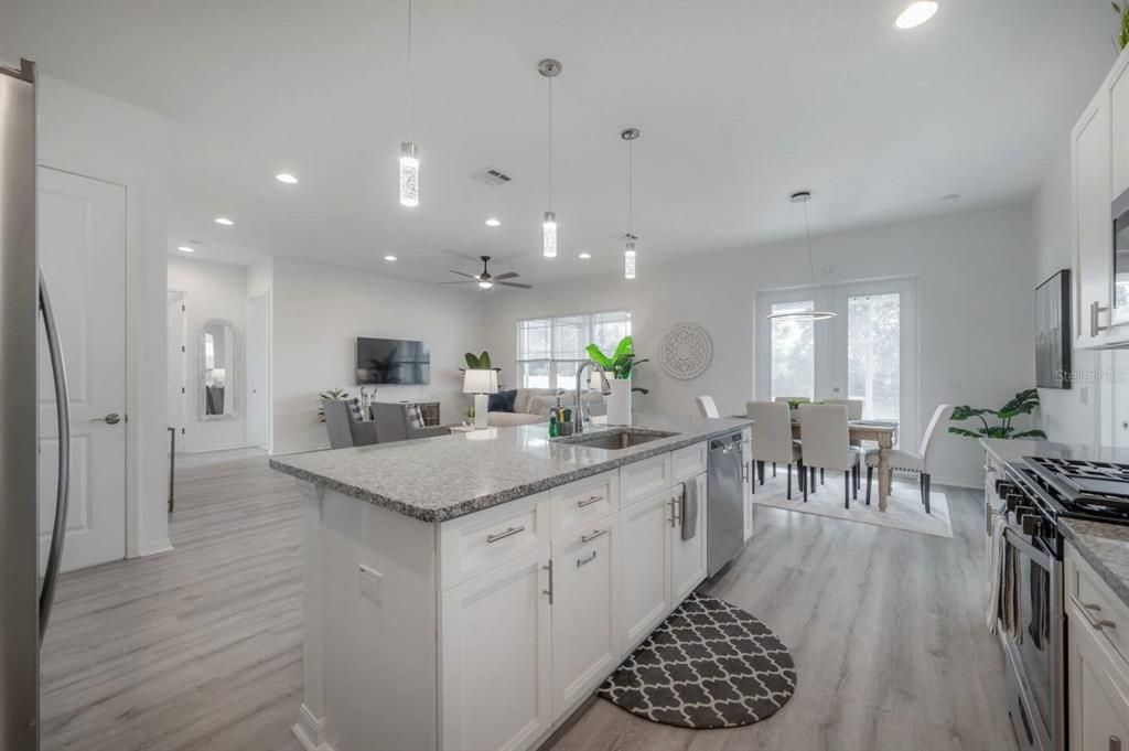 Kitchen Area with Modern design with vaulted ceilings and open floorplan. Gourmet Chefs' kitchen with new appliances and gas stove.