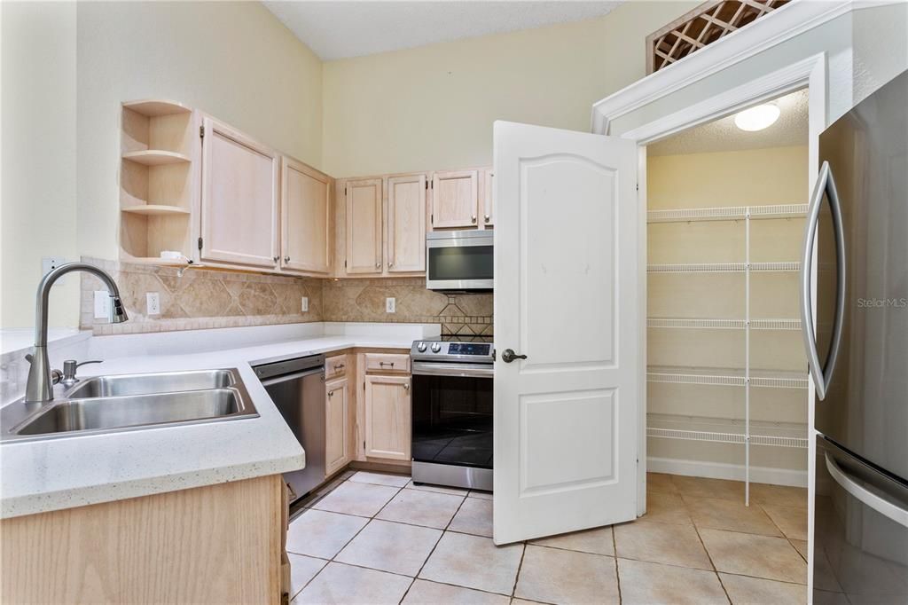 Kitchen with great counter top space and large pantry