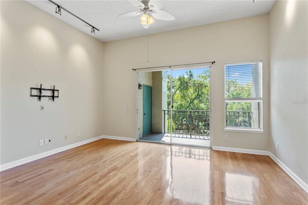 Spacious living room with high ceilings and natural light