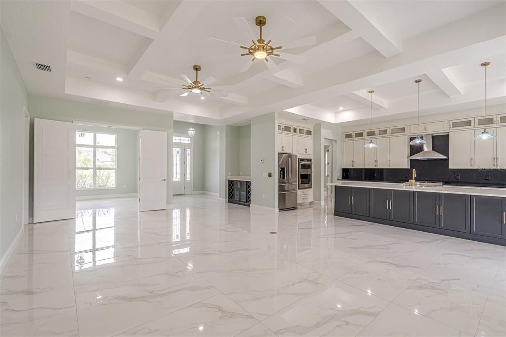 View of the Living Room showing the Flex Room, Kitchen & Foyer