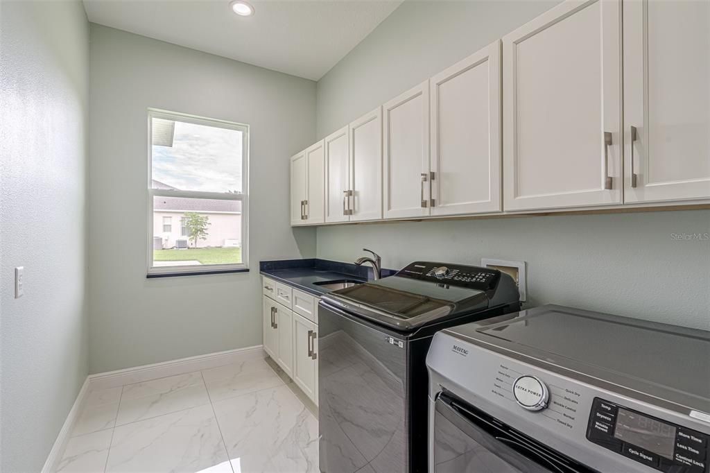 Interior Laundry Room with storage, folding area