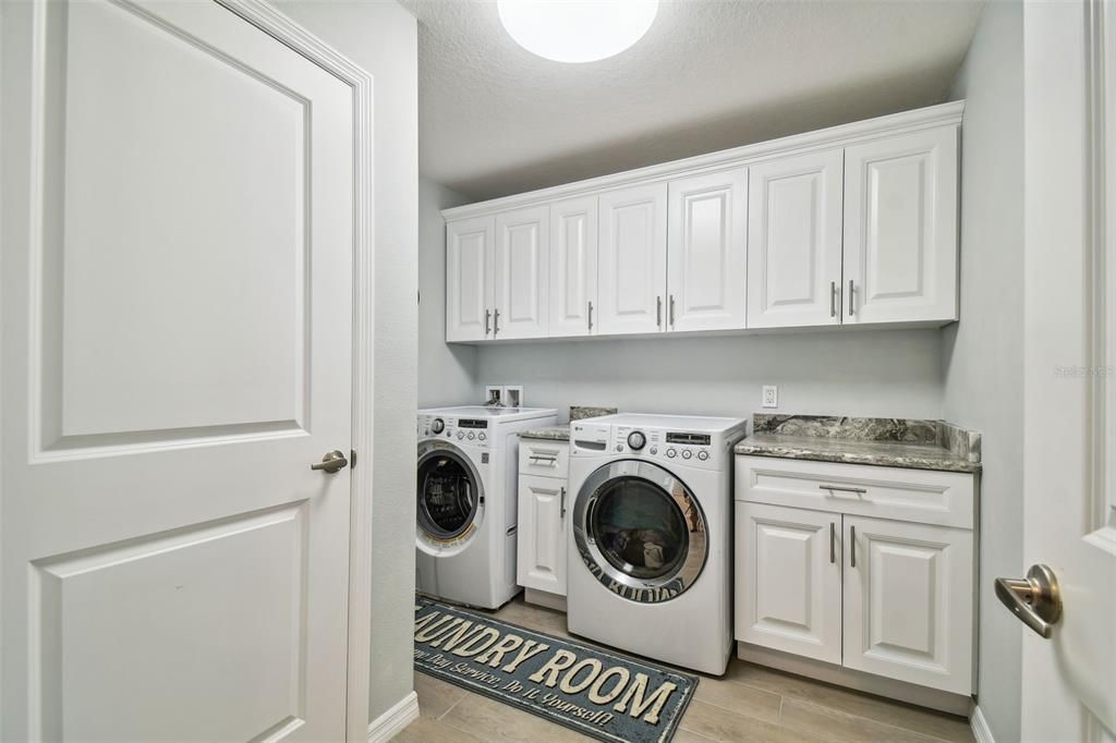 Spacious upstairs laundry room.