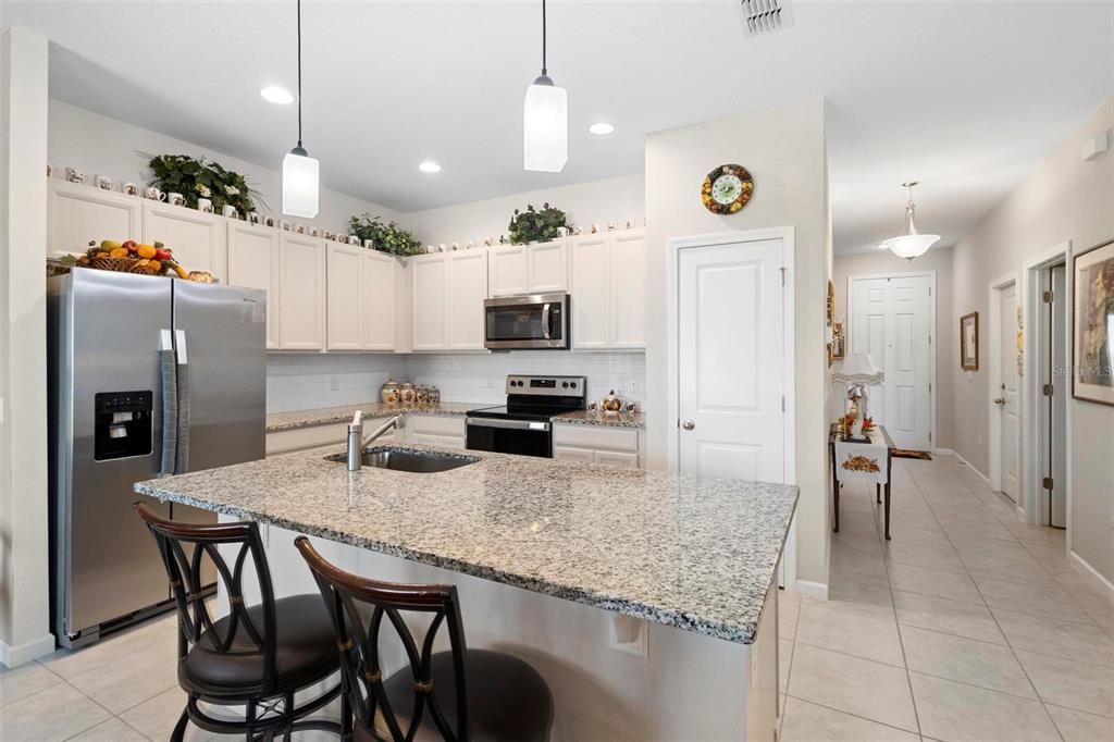 Luxury wood cabinets and lots of storage space with concealed pantry.