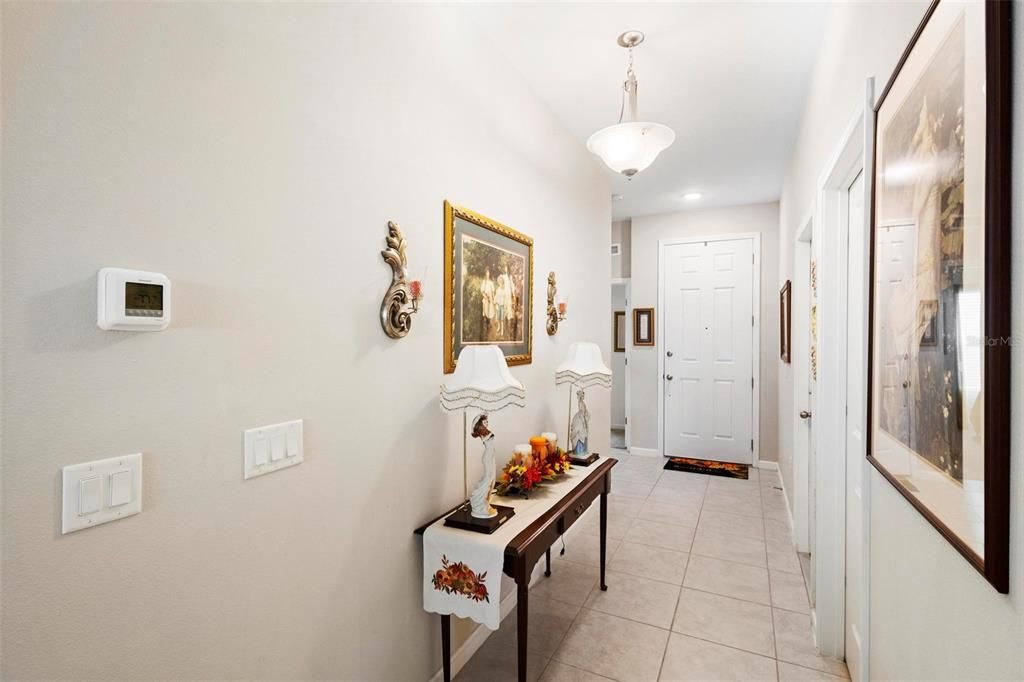 Front entrance hallway leading to front door.