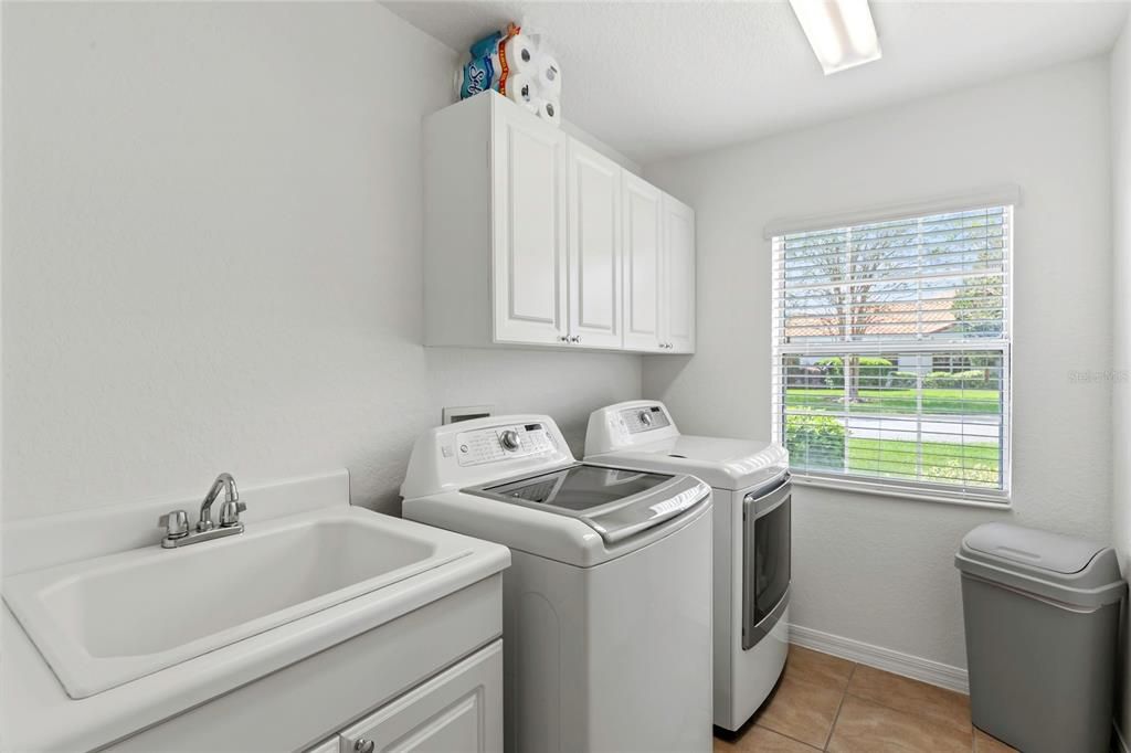 Indoor Laundry Room with Utility Sink & Added Storage