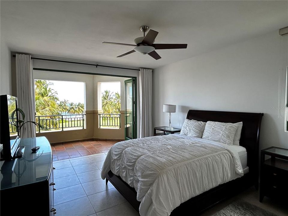 Master bedroom.  Open folding doors and enjoy the ocean breeze.