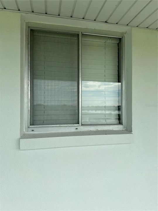 Kitchen window that would overlook the swimming pool and grounds.