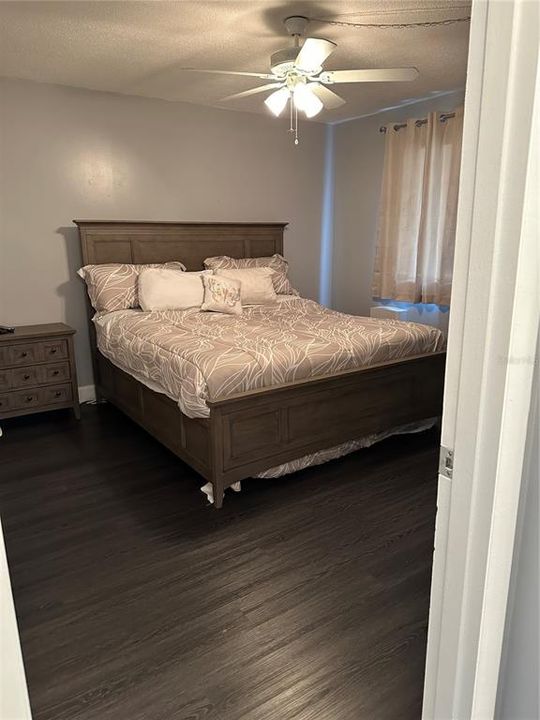 Master Bedroom with wood laminate floors.