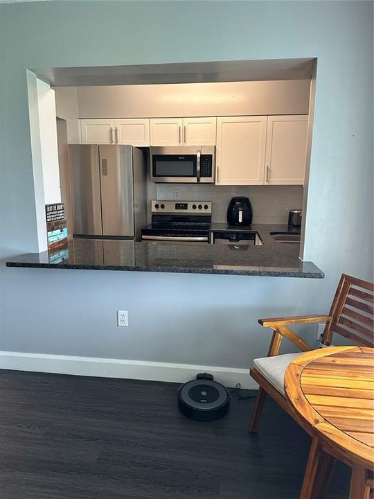 Kitchen view. Granite countertop.