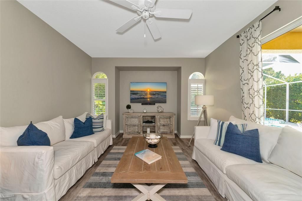 Family room w/ view to pool spa & lanai.