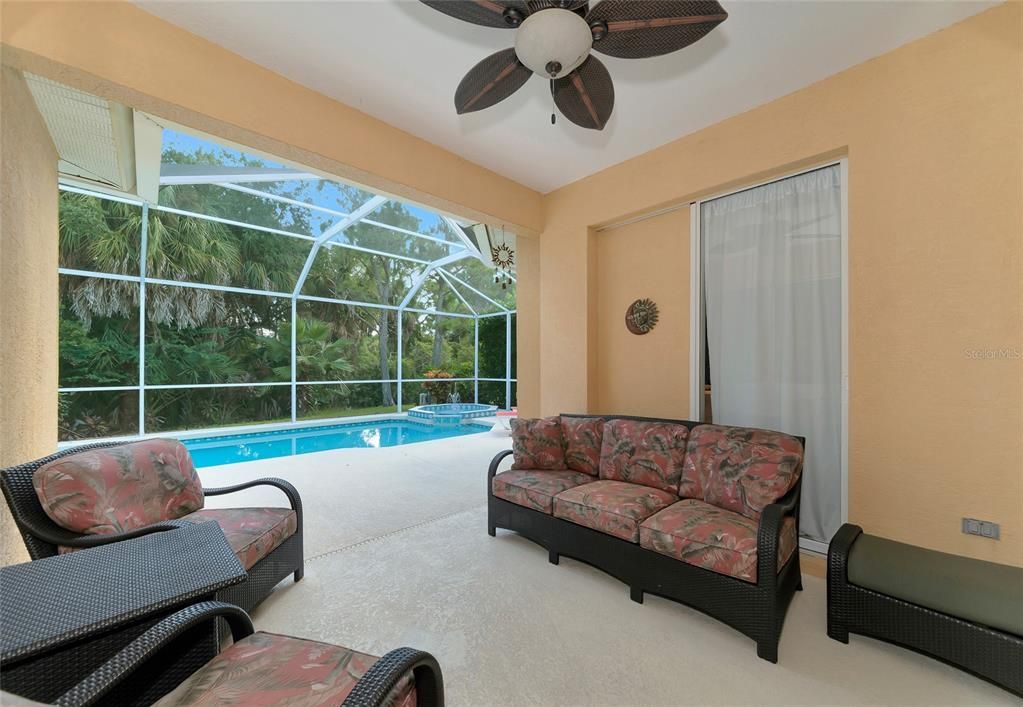 Covered lanai, pool, spa & private preserve views.