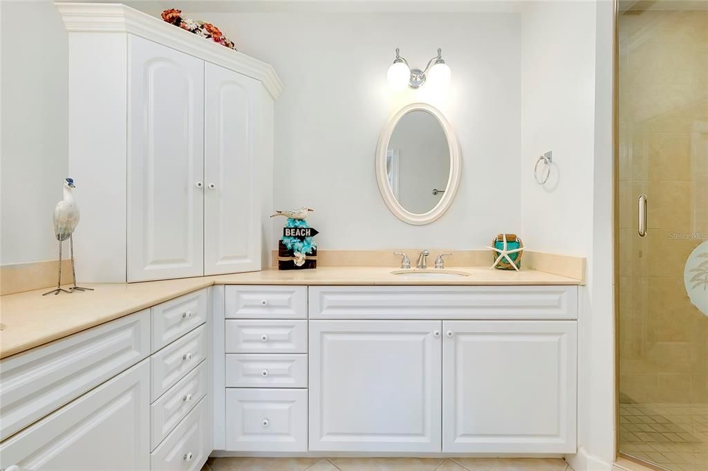 Main Bathroom with tile patterned flooring, vanity, and a shower with shower door