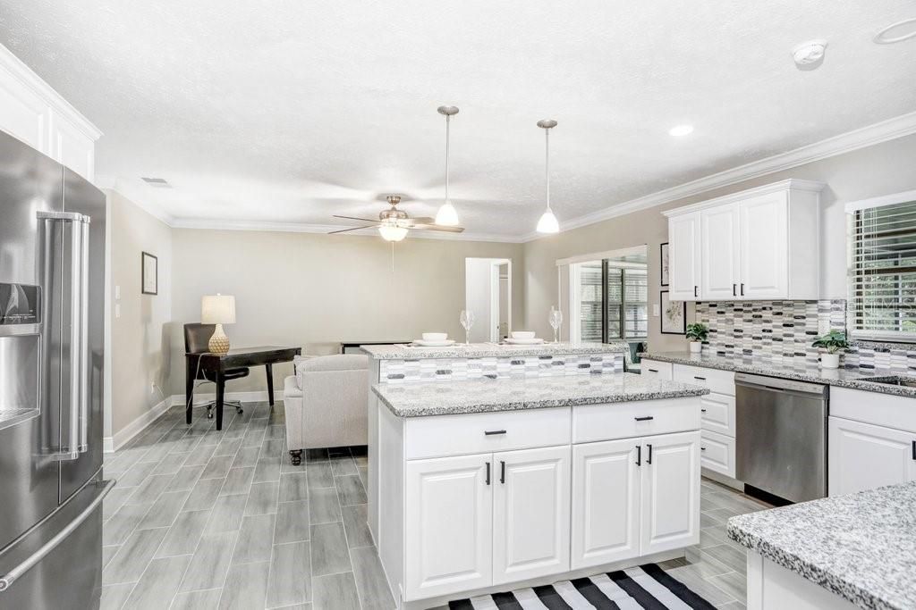 view of kitchen that is open to the bonus room