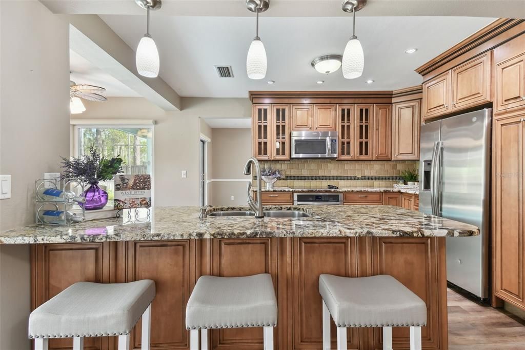 The sink in the peninsula is perfectly placed so the cook and cleaner gets to also enjoy all the fun. Best view in the house!