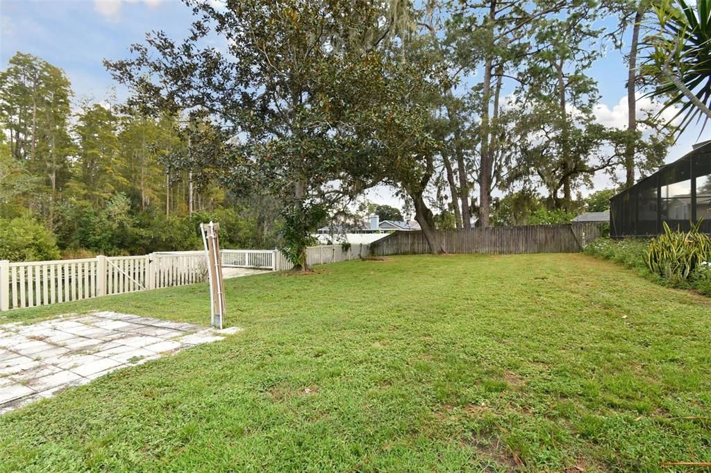 SOOO much room to play in this huge back yard and fully fenced from the pond with a dock.