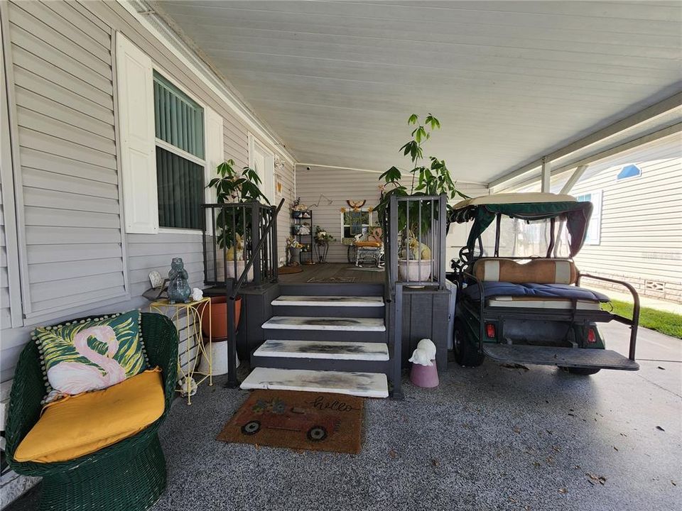 Carport entry with composite decking.