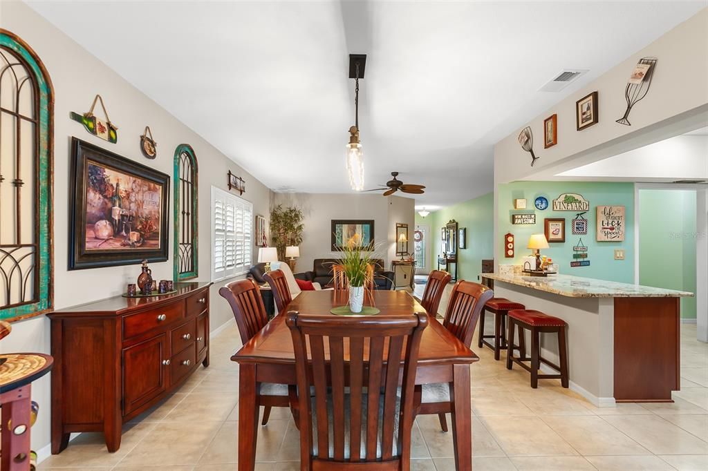 DINING ROOM, BREAKFAST BAR AND KITCHEN TO THE RIGHT