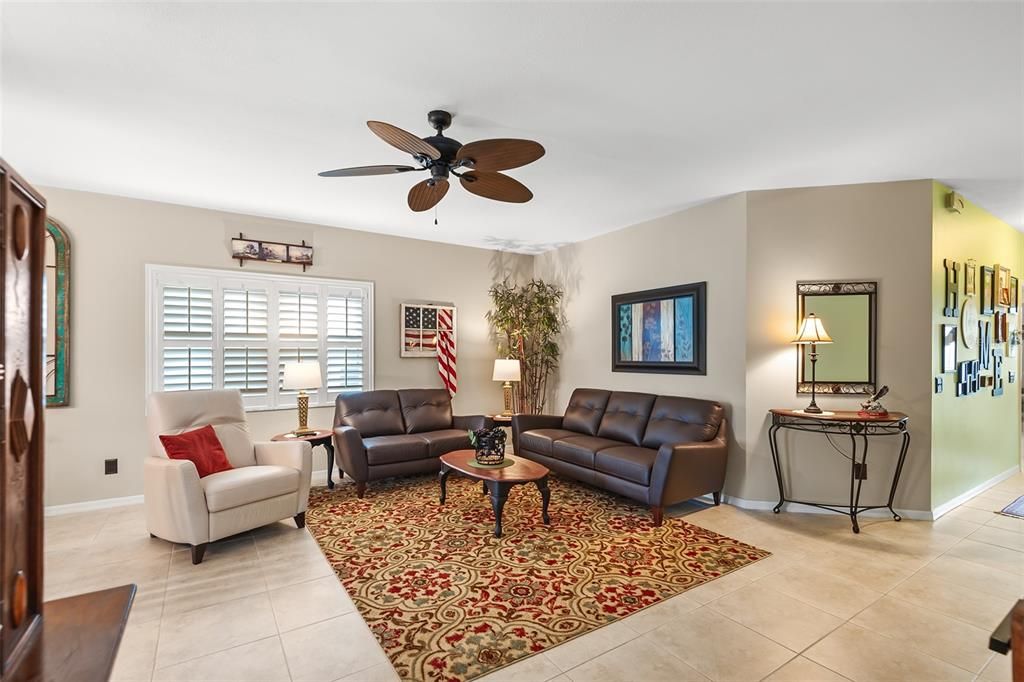 LIVING ROOM. ENTRY FOYER TO THE RIGHT