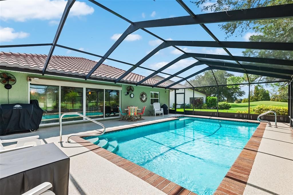 WHAT A FANTASTIC SCREENED IN POOL AREA FOR RELAXING AND/OR ENTERTAINING!