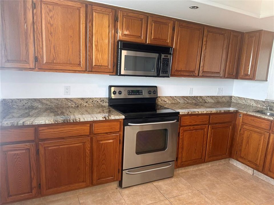 Gorgeous Granite Countertops and REAL wood Cabinets.