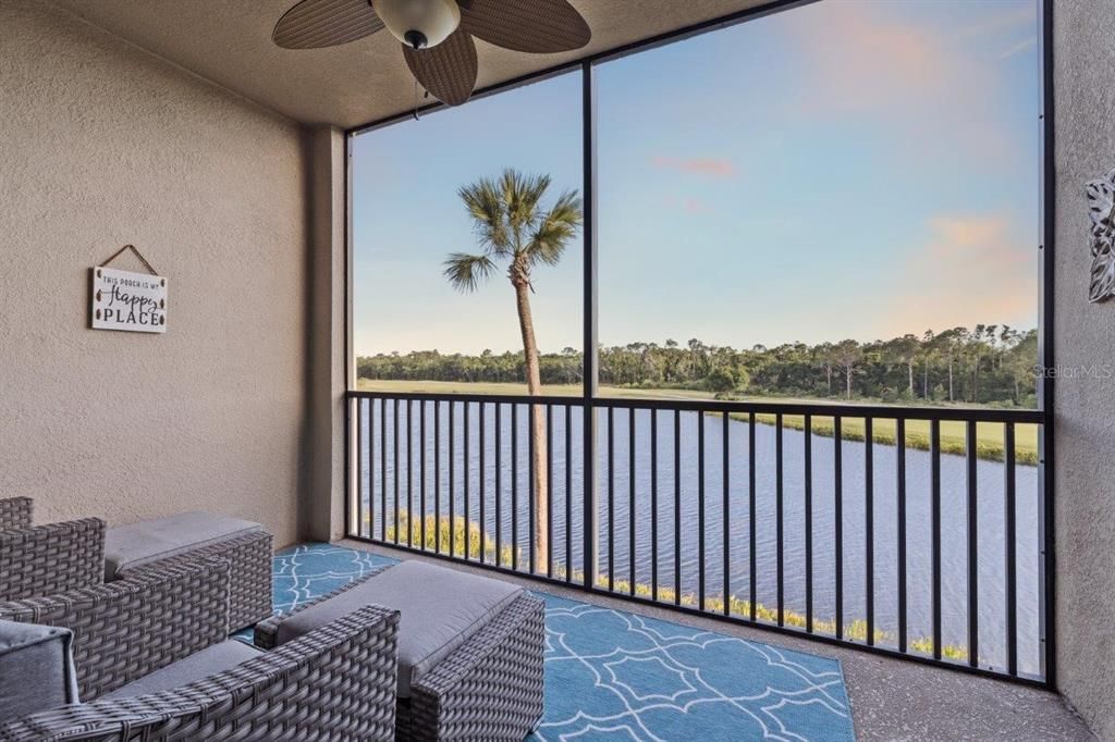 Covered screen-in lanai with beautiful lake and golf course views.