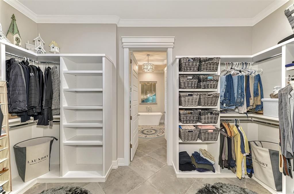 Master closet including built-in closets.