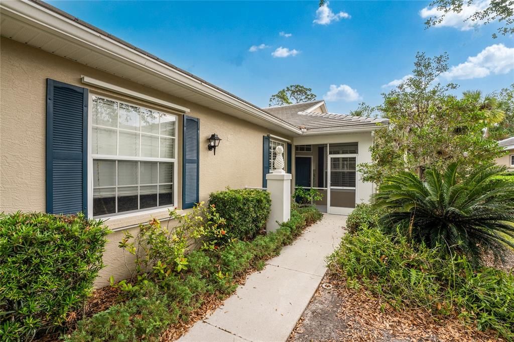 Private walkway to screened entry...