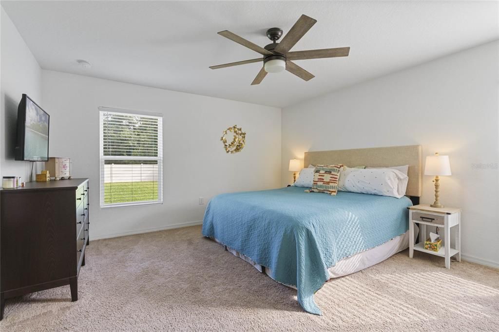 Tucked away on one side of the home your PRIMARY SUITE becomes a tranquil retreat with plush carpet, WALK-IN CLOSET and private en-suite bath.