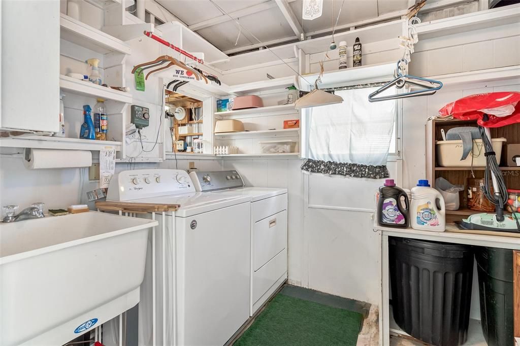 Washer and Dryer convey with Utility Sink in Laundry Room