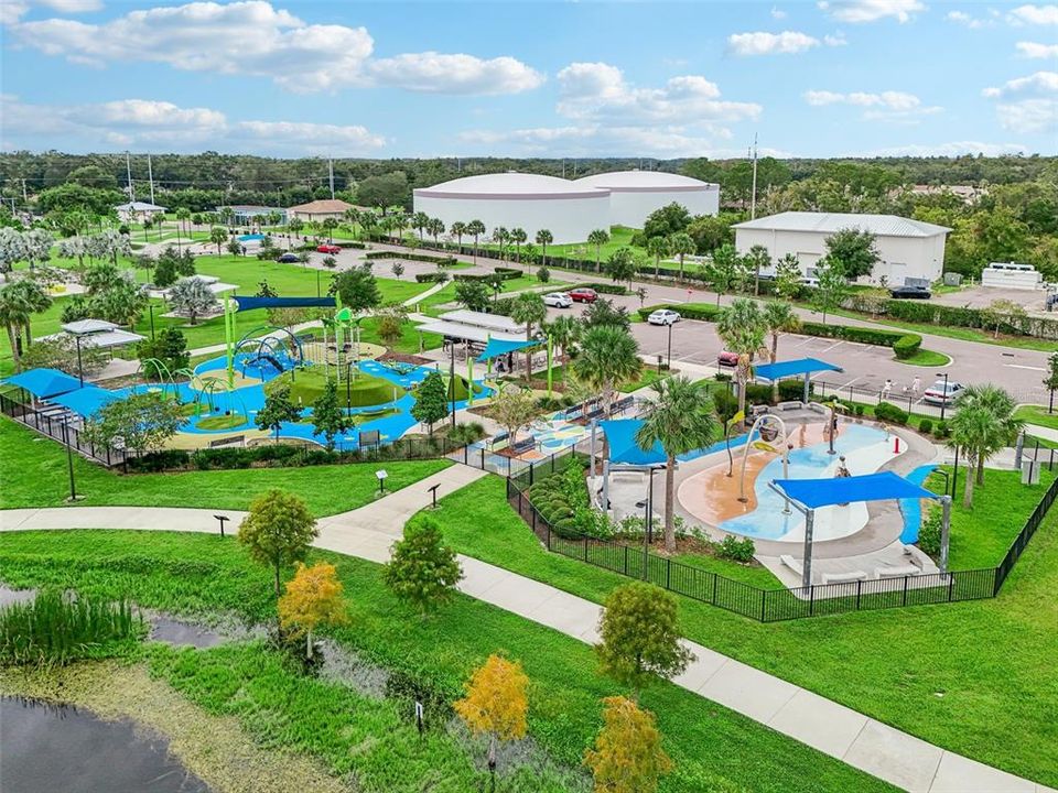 Area of Carrollwood Park with splash pads, play and picnic areas.