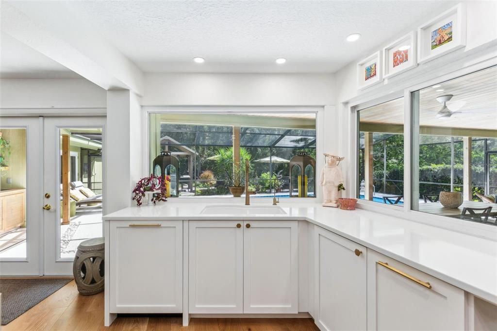 Kitchen opens to pool and lanai