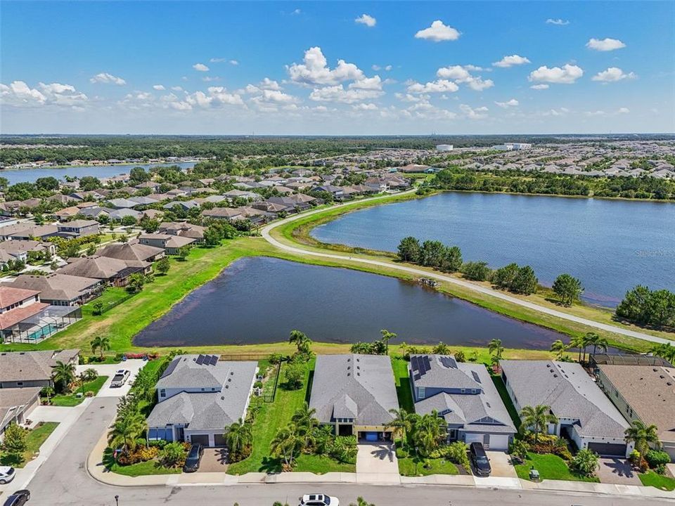 Clear view to a pond and then the largest lake in Waterset.  No walkers on the path in your immediate backyard.