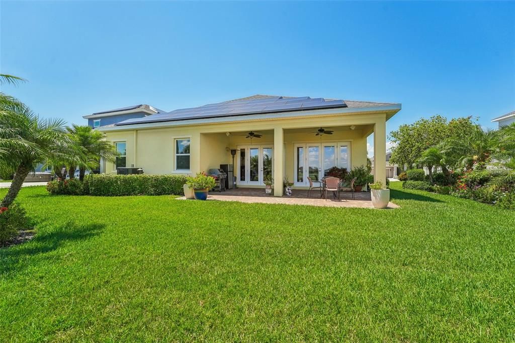 gorgeous mature landscaping down the side of the home for privacy and beauty