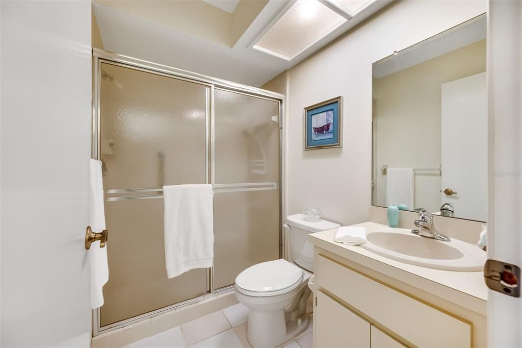 Separate tub/shower combo in the primary bathroom that is private.