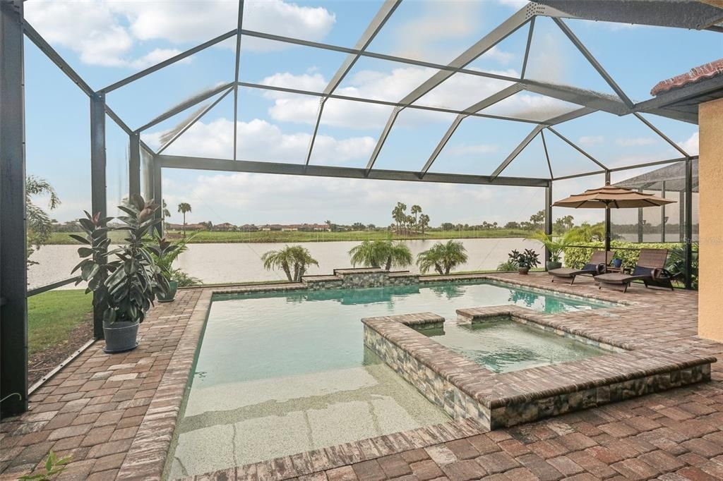 Pool view of SunSaucer Entry, oversized West Facing Hot Tub and Florida Fountain