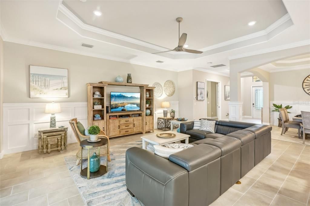 Living Room with Custom Trim and view Toward Front Door