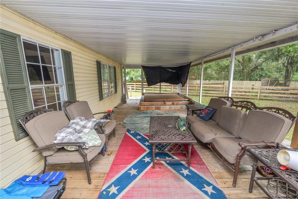 screened rear deck with access to dining and family rooms