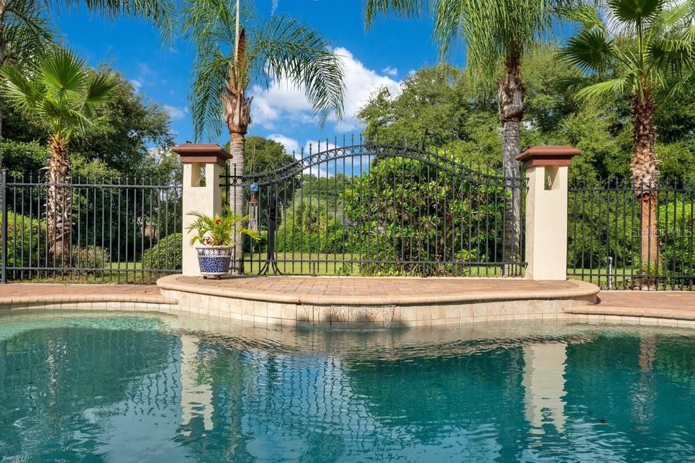 Beautiful fence detail surrounding pool area