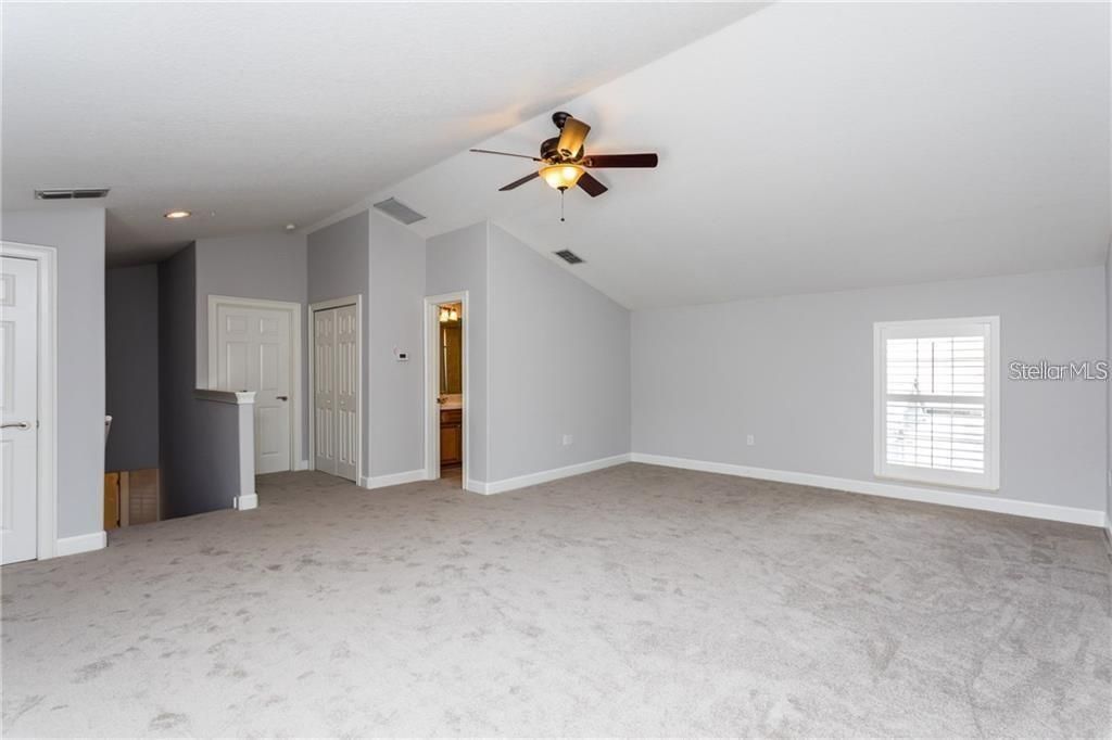 Bedroom 5 with full bath and walk-in closet. Could be used as a second family room, theater room, etc.