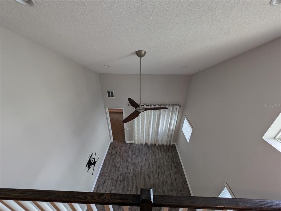 Looking down from Family Room to Living Room downstairs