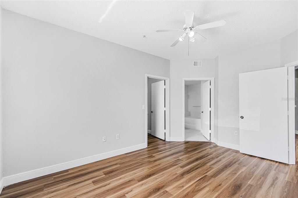 Master bedroom, viewing walk-in closet and bathroom.