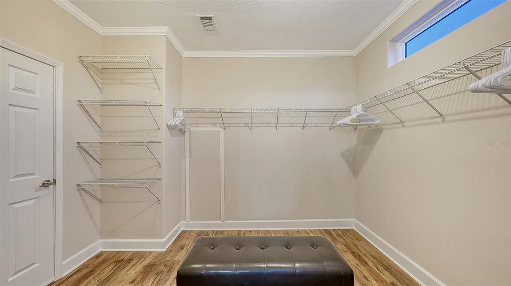 Large primary walk-in closet. Wonderful!