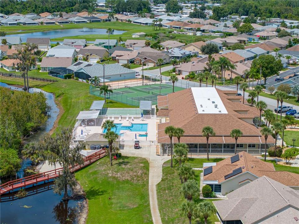 CLUBHOUSE WITH VIEW OF SPA, POOL, SHUFFLEBOARD, TENNIS & PICKLEBALL COURTS & BOCCE BALL