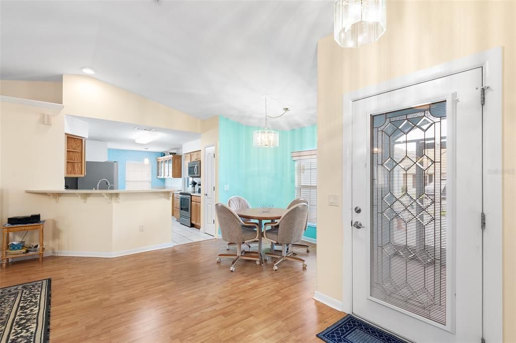 FRONT ENTRY WITH VIEW TOWARDS DINING ROOM & KITCHEN