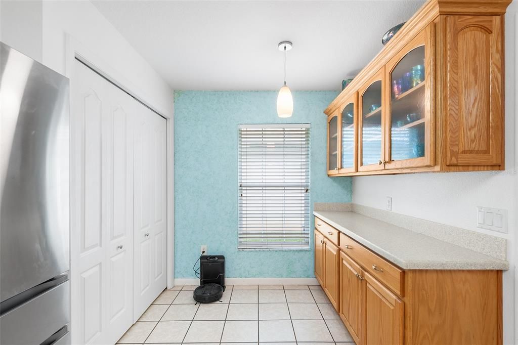 LAUNDRY CLOSET TO THE LEFT ADDITIONAL CABINETRY & COUNTERTOP ON RIGHT