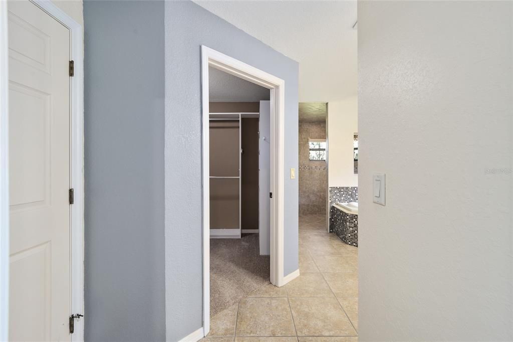 Primary bathroom one walk in closet entrance