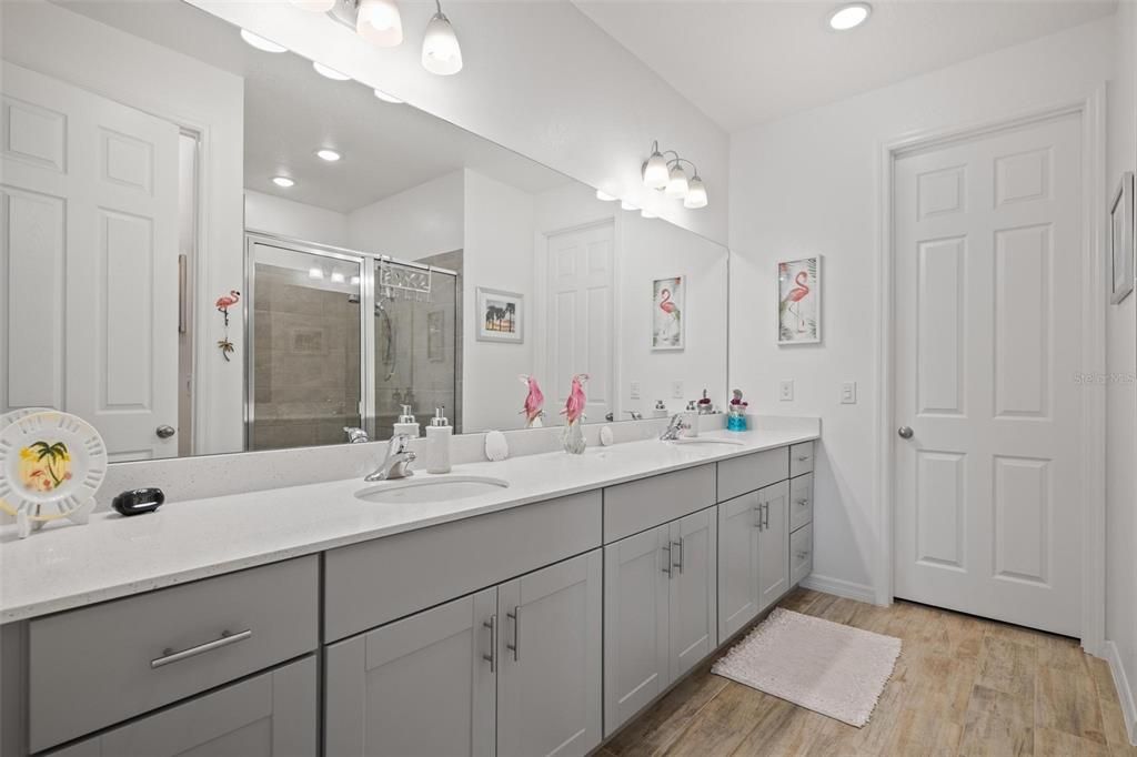 The main bedroom features neutral carpet that seamlessly connects to the bathroom, which showcases stylish neutral tile and upgraded white paint. This versatile design makes it easy for you to add your own personal touches and decorations!"