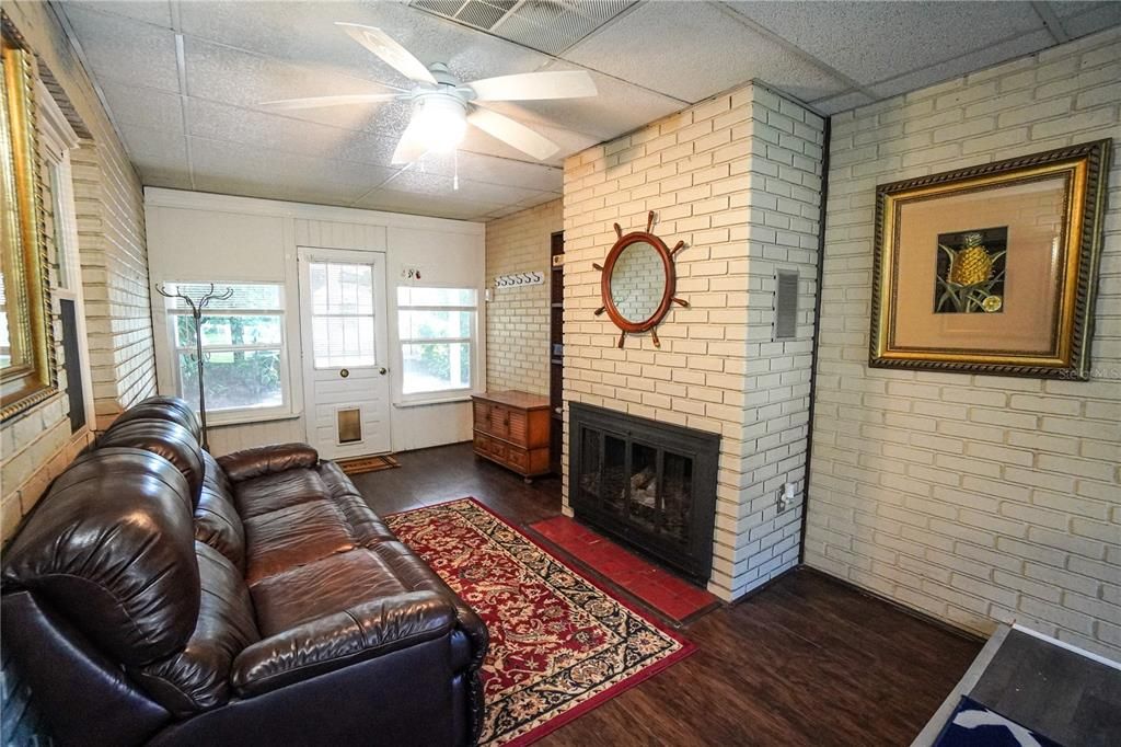 Step down Fam room with fireplace and Back door